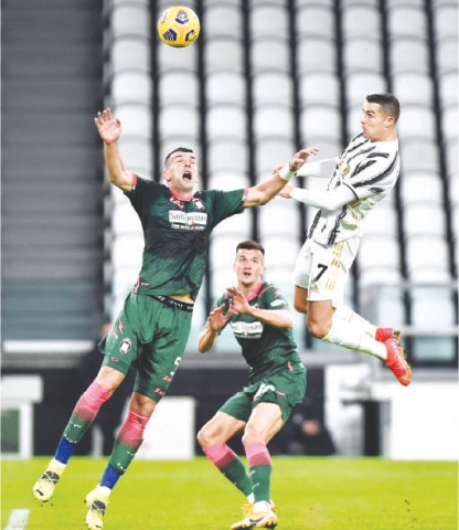 TURIN: Juventus&rsquo; Cristiano Ronaldo heads to score during the Serie A match against Crotone at the Allianz Stadium.&mdash;Reuters