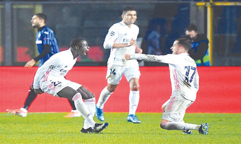 BERGAMO: Real Madrid&rsquo;s Ferland Mendy (L) celebrates with team-mates after scoring during the Champions League round-of-16 first leg against Atalanta at the Stadio Atleti Azzurri.&mdash;Reuters