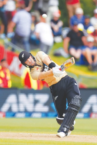 NEW ZEALAND opener Martin Guptill hits a six during the second Twenty20 International against Australia at the University Oval on Thursday.—AFP