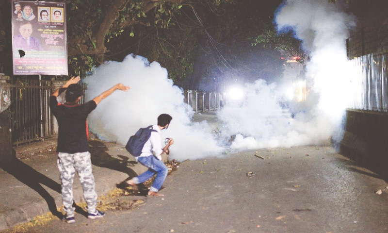 POLICE use tear gas shells on demonstrators protesting the writer’s death in prison. — AP