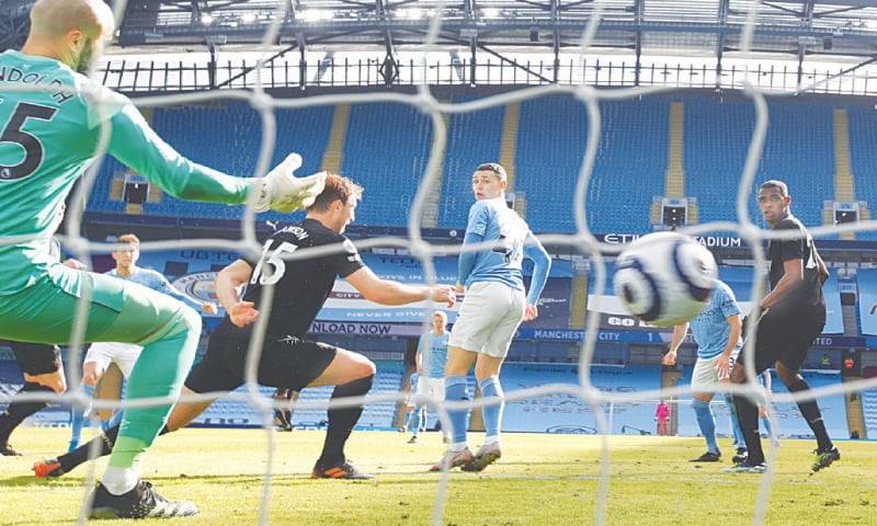 MANCHESTER City&rsquo;s John Stones (second L, obscure) scores against West Ham United during their English Premier League match at the Etihad Stadium on Saturday. &mdash; AP
