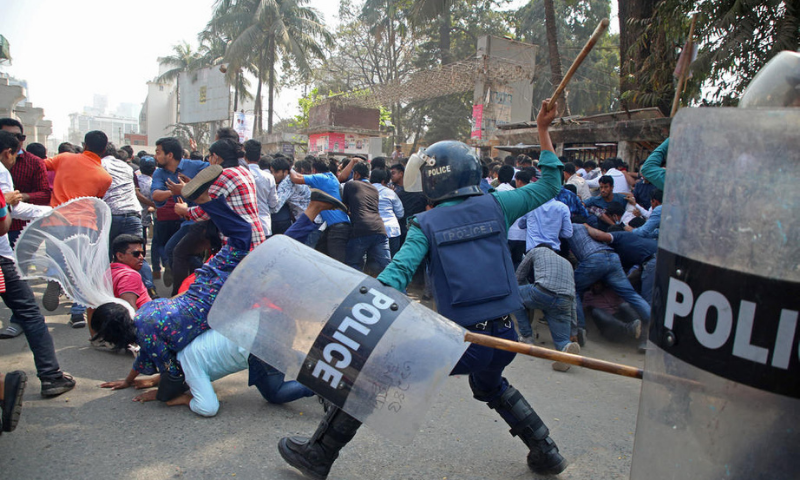 Policemen clash with the activists of Bangladesh Nationalist Party during the third day of protests following the death of Mushtaq Ahmed, a prominent writer and government critic in jail, in front of the National Press Club in Dhaka on Sunday. — AFP