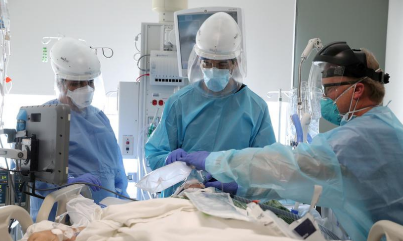 Dr Dan Ponticiello and Dr Gabriel Gomez intubate a coronavirus patient in the Covid-19 ICU at Providence Mission Hospital in Mission Viejo, California. &mdash; Reuters/File