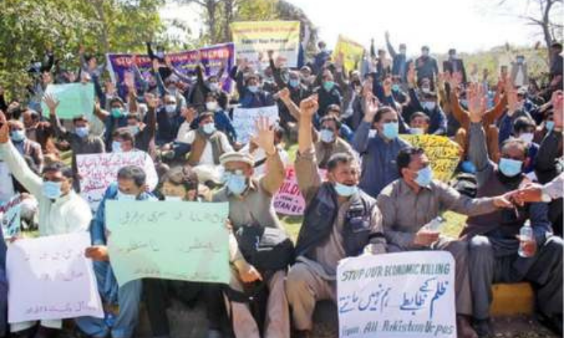 Sacked health workers raise slogans during their protest outside the WHO office in Islamabad on Tuesday. — Online