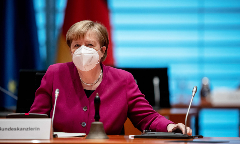 German Chancellor Angela Merkel wears a face mask as she arrives to chair the government's weekly cabinet meeting at the Chancellery in Berlin. &mdash; AFP