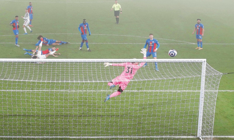 LONDON: A shot from Manchester United&rsquo;s Mason Greenwood (second L) goes over the bar during the English Premier League match against Crystal Palace at Selhurst Park.&mdash;AFP