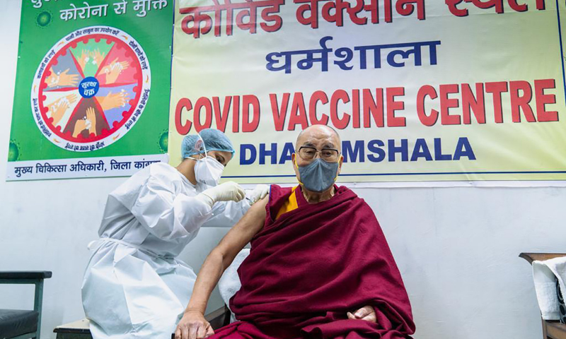 This photograph shows the Tibetan spiritual leader receiving a shot of the Covid-19 vaccine at Zonal Hospital in Dharmsala, India. &mdash; AP