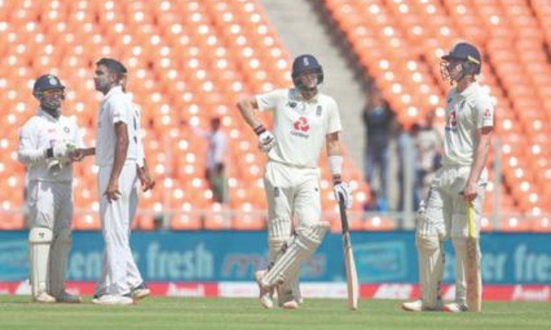 AHMEDABAD: England captain Joe Root (second R) awaits third umpire’s decision before he is given out to India spinner Ravichandran Ashwin (second L) during the fourth Test on Saturday. — AP