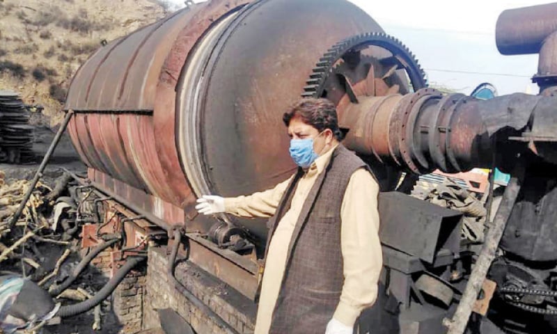 An official of the local administration inspects a tyre-derived fuel plant on Tuesday which was sealed for polluting the environment. — Dawn An official of the local administration inspects a tyre-derived fuel plant on Tuesday which was sealed for polluting the environment. — Dawn