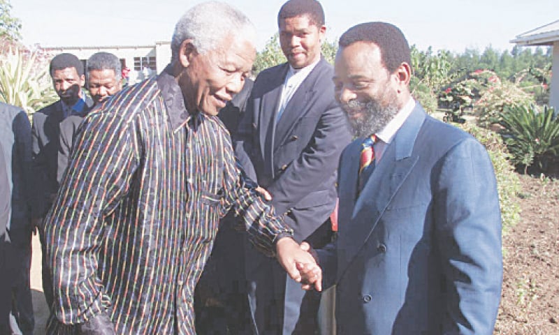 GOODWILL Zwelithini (right) photographed with South African President Nelson Mandela in this June 12, 1999, file photo.—AFP