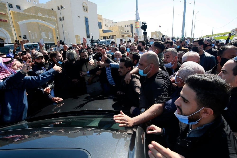 Angry people gather outside Al-Hussein Al Salt Hospital in Salt, Jordan on Saturday, March 13. — AP