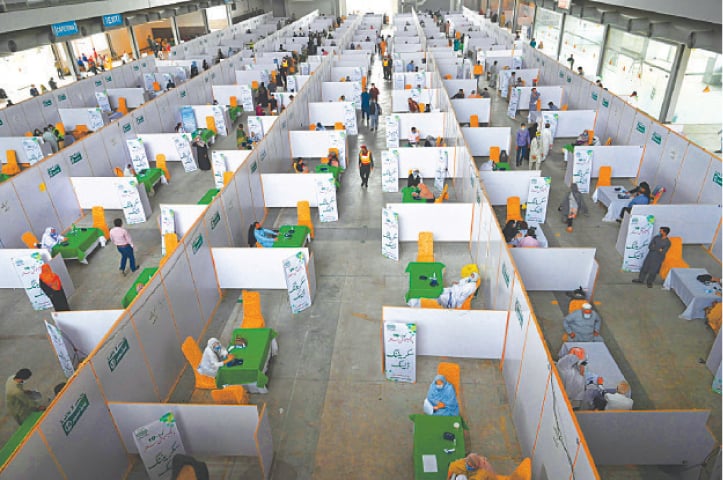 LAHORE: Senior citizens receive jabs of Chinese-made Sinopharm vaccine on Tuesday at a vaccination centre set up at Expo Centre.—M Arif / White Star