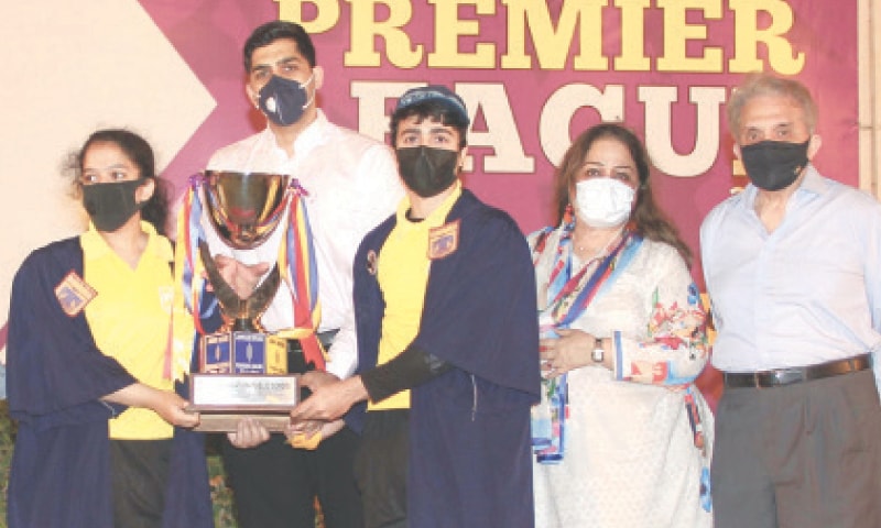 KARACHI: Iqbal House captains Eman Tariq and Hamza Salman receive FPS Premier League trophy from Rehman Minhas as Raza Kamal Minhas, Yasmeen Minhas and Sabeeha Mohammad look on. KARACHI: Iqbal House captains Eman Tariq and Hamza Salman receive FPS Premier League trophy from Rehman Minhas as Raza Kamal Minhas, Yasmeen Minhas and Sabeeha Mohammad look on.