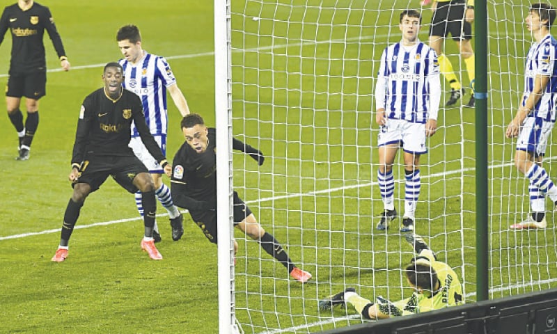 SAN SEBASTIAN: Barcelona&rsquo;s Sergino Dest scores against Real Sociedad during their La Liga match at the Reale Arena Stadium.&mdash;AP
