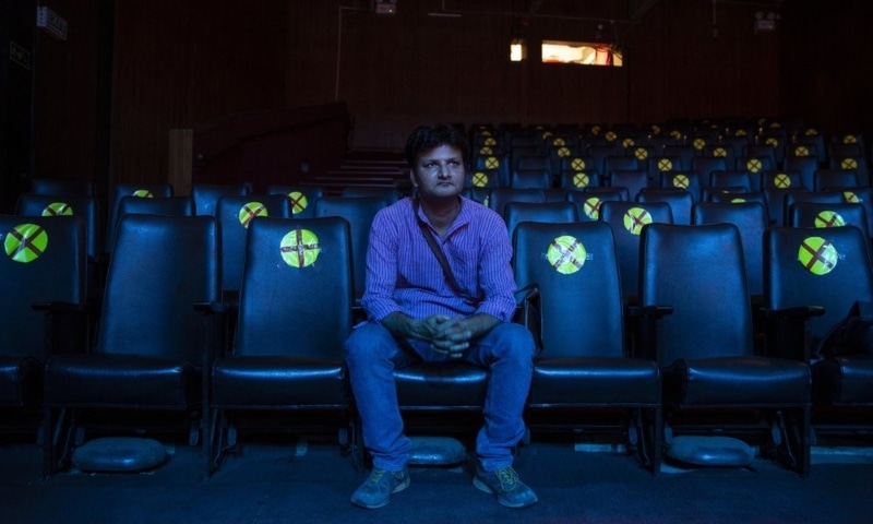 A theatre artist, watches a rehearsal of an upcoming show he is managing at a theatre in New Delhi, India, March 16. — AP