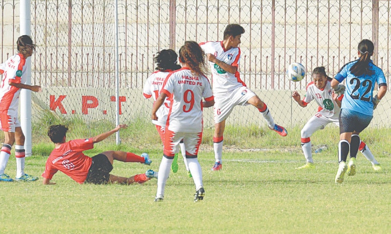 KARACHI United&rsquo;s Suha Hirani (second L) sees her goal-bound 
effort cleared off the line during the National Women&rsquo;s Championship match against Masha United at the KPT Stadium on Thursday.
&mdash; Tahir Jamal/White Star