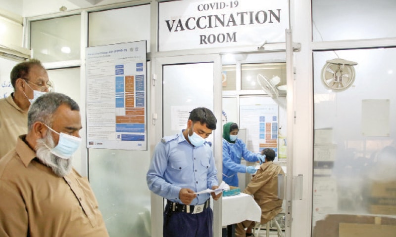 A man receives Covid-19 vaccine shot at CDA Hospital in Islamabad as vaccination of citizens aged 50 and above started on Tuesday. &mdash; Photo by Mohammad Asim