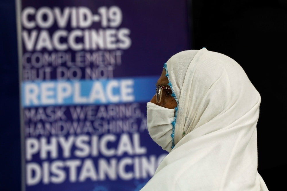An elderly resident sits in a waiting area after receiving a dose of the coronavirus vaccine at a vaccination centre in Karachi on April 1. — Reuters
