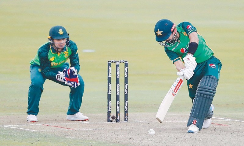 Pakistan captain Babar Azam drives during his innings of 103 as South African wicket-keeper Quinton de Kock looks on during the first One-day International at the SuperSport on Friday. — AFP/File