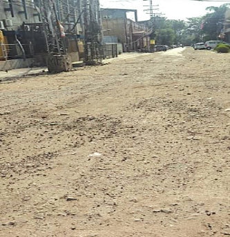 A road in a shambles in Gulberg&rsquo;s industrial area. &mdash; Dawn