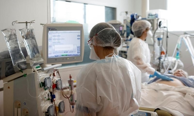 Medical staff members work in the ICU where patients suffering from Covid-19 are treated at ELSAN's private hospital Clinique Oceane in Vannes, France, April 7. &mdash; Reuters