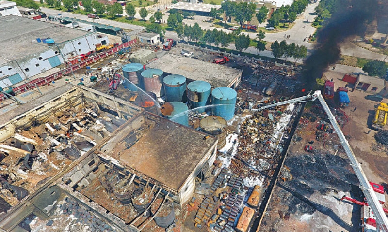 Firefighters try to control the blaze in a Sundar chemical factory. — White Star