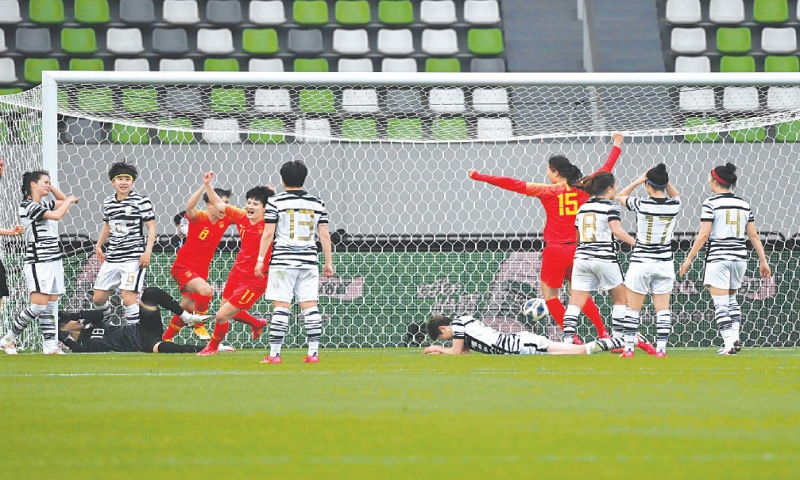 SUZHOU: Chinese women players celebrate a goal against South Korea during their Tokyo Olympic qualifying play-off second leg at the Suzhou Olympic Sports Centre Stadium on Tuesday.&mdash;AFP