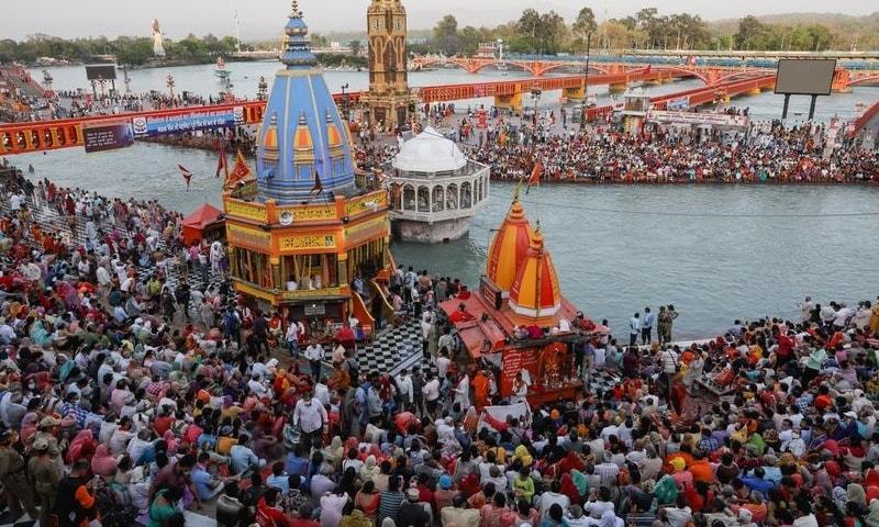 Devotees gather for evening prayer on the banks of the Ganges river during Kumbh Mela, or the Pitcher Festival in Haridwar, India, April 13. &mdash; Reuters
