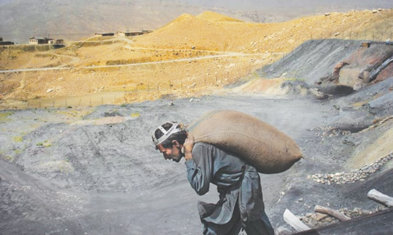 A miner hauls a sack of coal on his back. — Mukhtar Azad/File A miner hauls a sack of coal on his back. — Mukhtar Azad/File