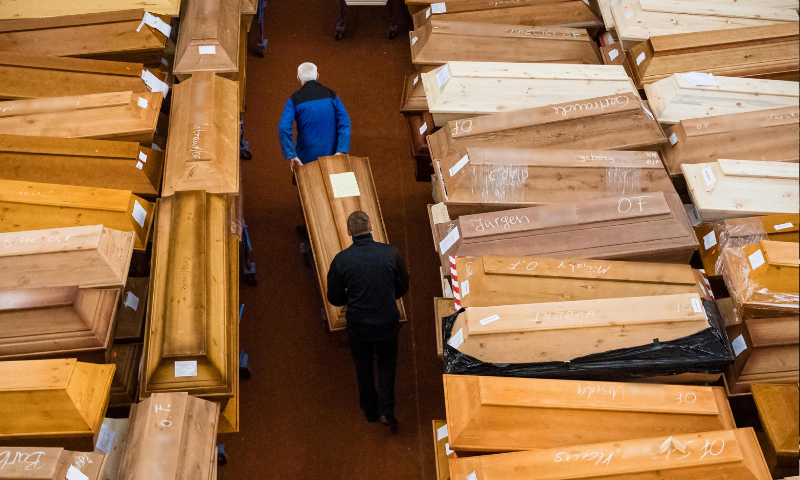 In this file photo taken on January 13, employees store coffins, some marked with “infection risk” as others have “corona” scrawled in chalk, in the mourning hall of the crematorium in Meissen, eastern Germany. — AFP