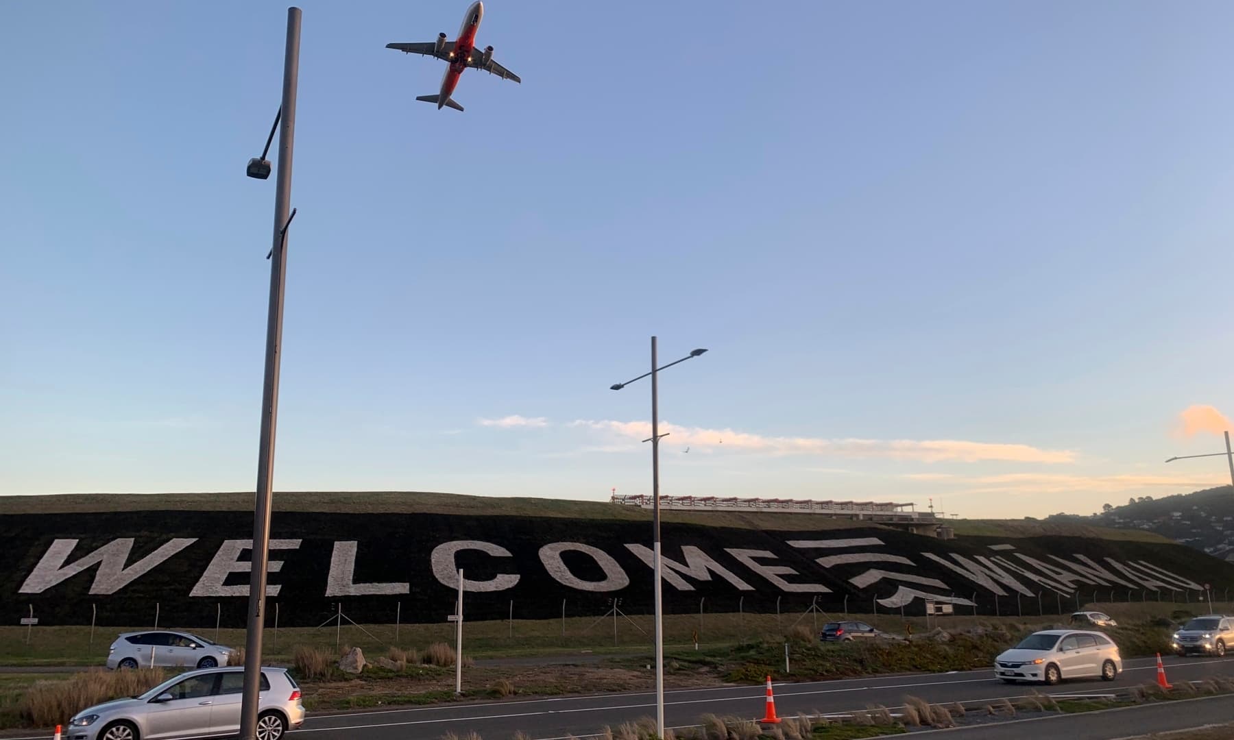 A giant sign painted near the main runway of the Wellington International Airport greets travellers returning home in Wellington, New Zealand Monday, April 19. The sign reads “Welcome Whanau” with the second word an Indigenous Maori word meaning family. — AP