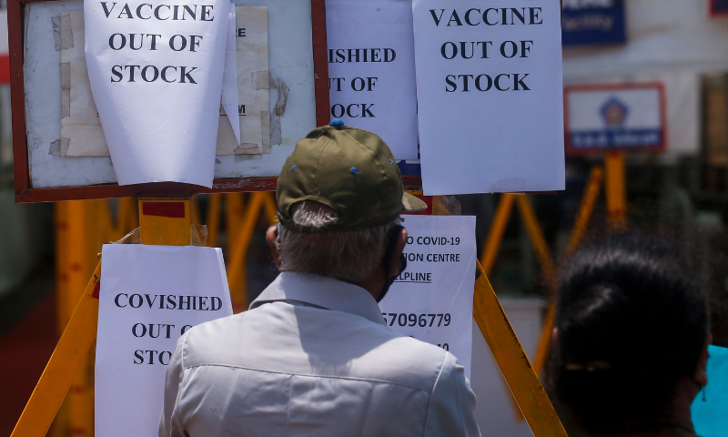 A notice informing about the shortage of Covid-19 vaccine is displayed on the gate of a vaccination centre in Mumbai, India. &mdash; AP