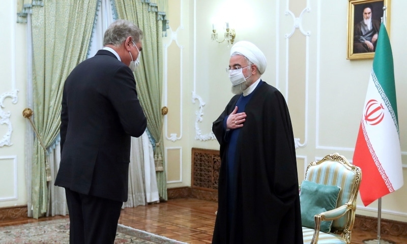 Iranian President Hassan Rouhani, right, welcomes Foreign Minister Shah Mahmood Qureshi for their meeting in Tehran, Iran, Wednesday, April 21. — Iranian Presidency Office via AP