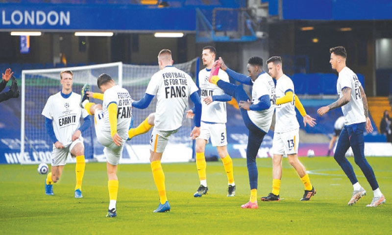 BRIGHTON players wear anti-European Super League t-shirts as they warm up ahead of the match.—AFP