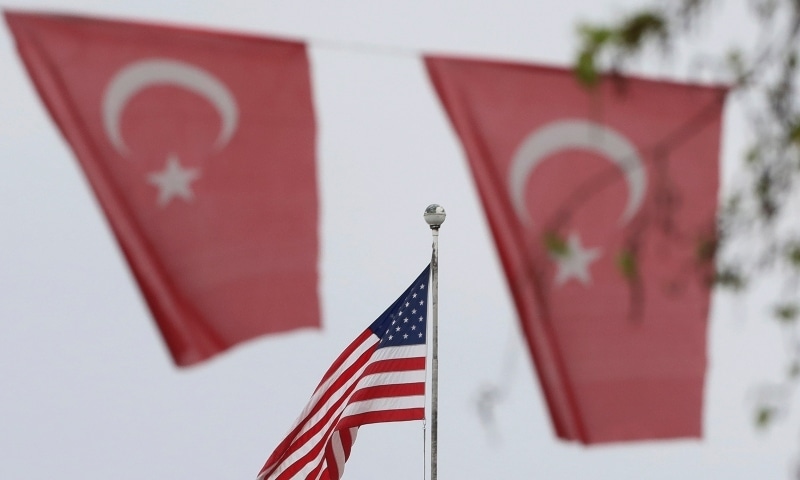 Turkish flags decorate a street outside the United States embassy in Ankara on April 25. &mdash; AP