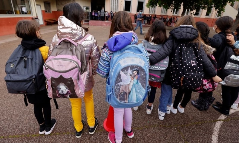 Schoolchildren gather in the playground as they return to classes at Lepeltier primary school in La Trinite, near Nice, France on Monday. — Reuters