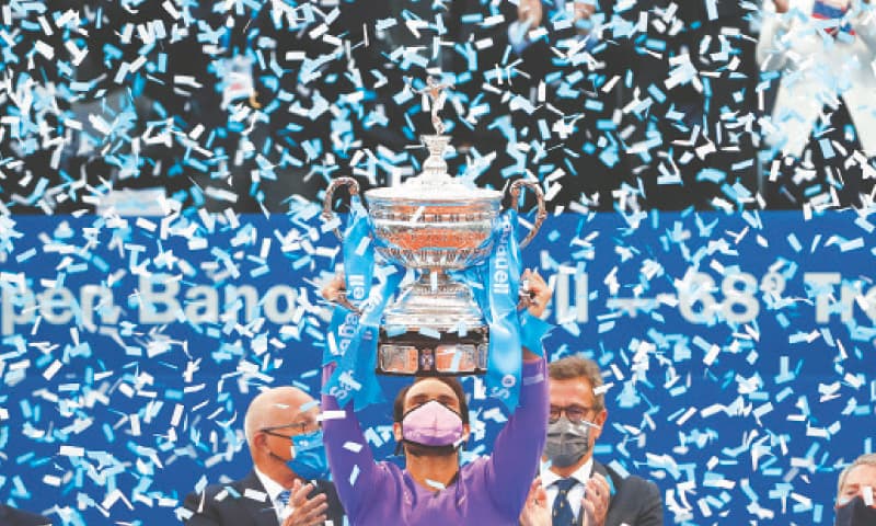 RAFAEL Nadal lifts the trophy after winning the Barcelona Open final against Stefanos Tsitsipas.—AP RAFAEL Nadal lifts the trophy after winning the Barcelona Open final against Stefanos Tsitsipas.—AP