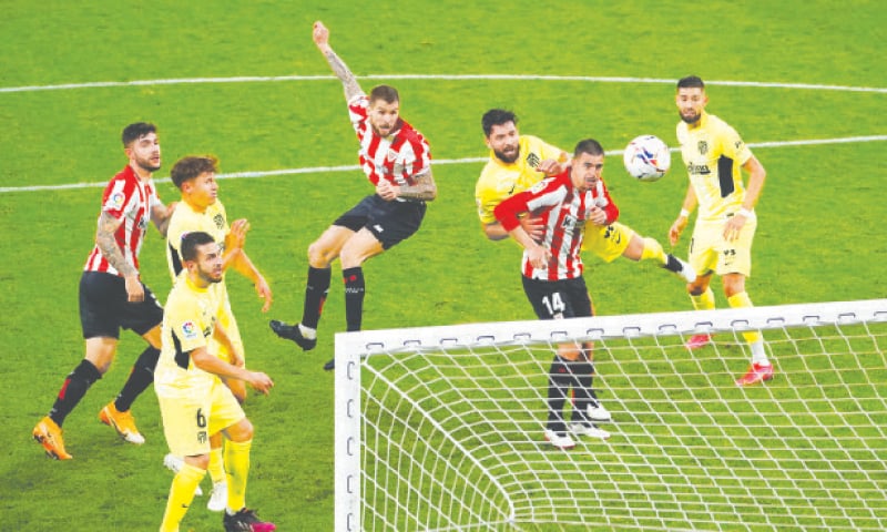 BILBAO: Athletic Bilbao’s Inigo Martinez (C) heads to score during the La Liga match against Atletico Madrid at Estadio de San Mames.—Reuters BILBAO: Athletic Bilbao’s Inigo Martinez (C) heads to score during the La Liga match against Atletico Madrid at Estadio de San Mames.—Reuters