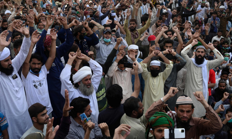 Supporters of the banned Tehreek-e-Labbaik Pakistan (TLP) party shout sloans as they block a street during a protest on April 19. — AFP/File