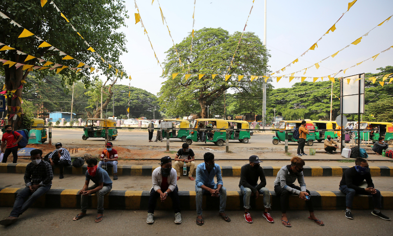 Travellers wait for outstation trains after authorities imposed a two-week lockdown to curb the rising number of Covid-19 cases in Bengaluru, India. — AP