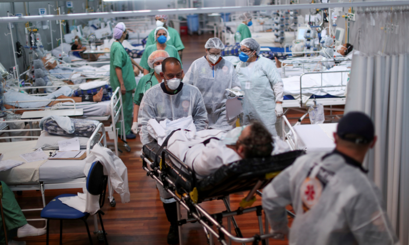 A patient suffering from the coronavirus is transported at a field hospital set up at Dell'Antonia sports gym in Santo Andre, on the outskirts of Sao Paulo, Brazil. &mdash; Reuters/File