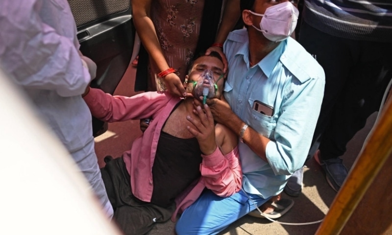 A patient breathes with the help of oxygen provided by a gurdwara or Sikh temple in Ghaziabad. — AFP
