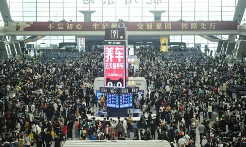 Passengers prepare to board trains at Hangzhou East train station in Hangzhou, in China's eastern Zhejiang province on April 30, ahead of the Labour Day holiday. &mdash; AFP