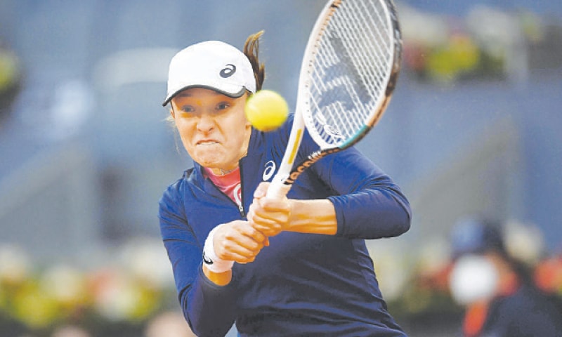 IGA Swiatek of Poland in action against Australia’s Ashleigh Barty during their Madrid Open match at the Caja Magica.—AFP