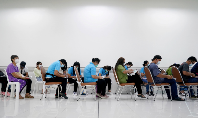 People wait to receive the second dose of Sinovac's Covid-19 vaccine at the Bang Khun Thian Geriatric Hospital in Bangkok, Thailand. &mdash; Reuters/File