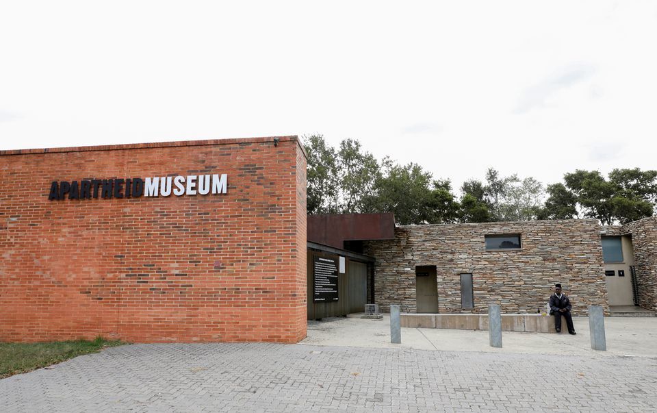 A security officer sits at the entrance of the Apartheid Museum, Johannesburg, South Africa, April 7. — Reuters