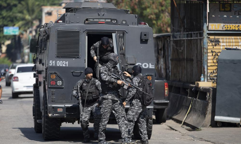 Police get out of an armoured vehicle during an operation against alleged drug traffickers in the Jacarezinho favela of Rio de Janeiro, Brazil. — AP Police get out of an armoured vehicle during an operation against alleged drug traffickers in the Jacarezinho favela of Rio de Janeiro, Brazil. — AP