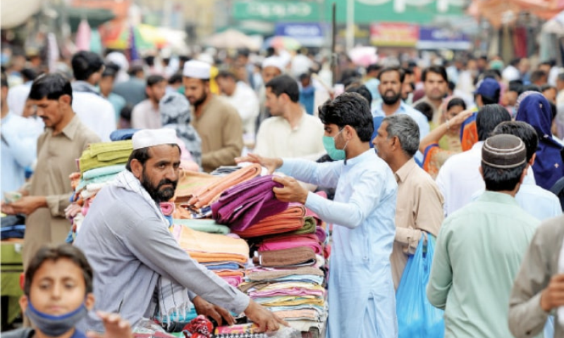 In this file photo, a large number of people throng Rawalpindi’s Bara Market. — Photo by Mohammad Asim