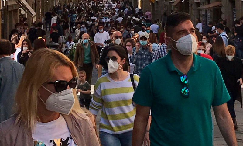 People gather in downtown Florence, Italy on Saturday following the relaxing of Covid-19 restrictions throughout the country. — AP