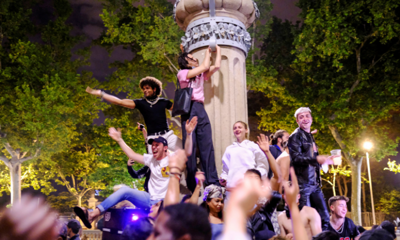 People gather in a &ldquo;macrobotellon&rdquo; (drinking and dancing session) on a street, as the state of emergency decreed by the Spanish government to prevent the spread of coronavirus is lifted in Barcelona. &mdash; Reuters